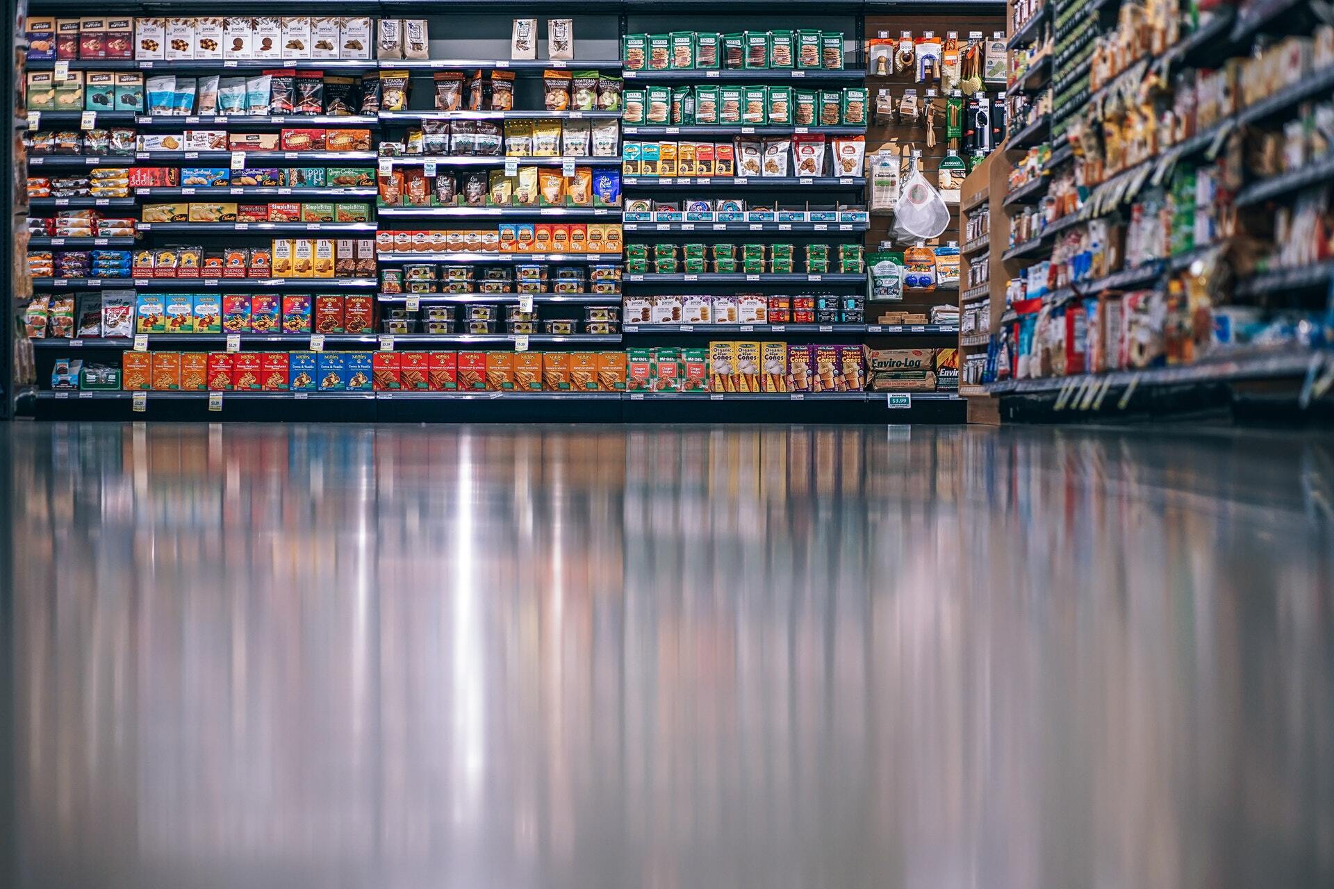 This is an image of shelves full of food at a grocery store.