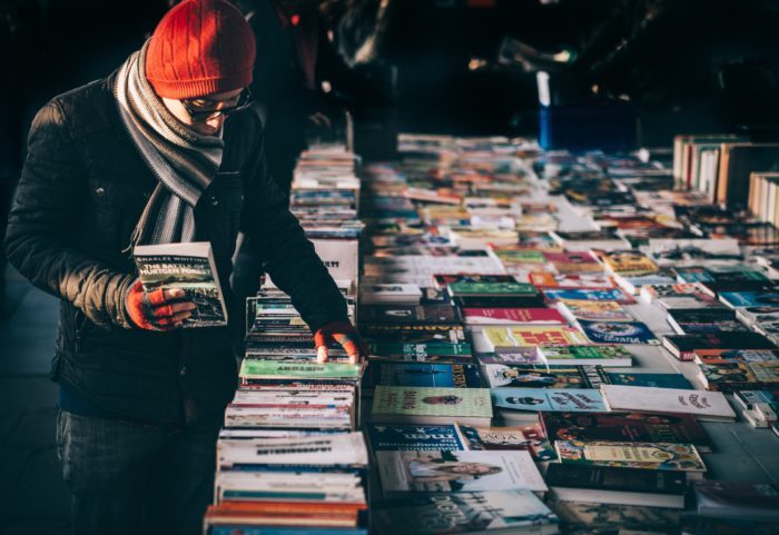 Person shopping for books