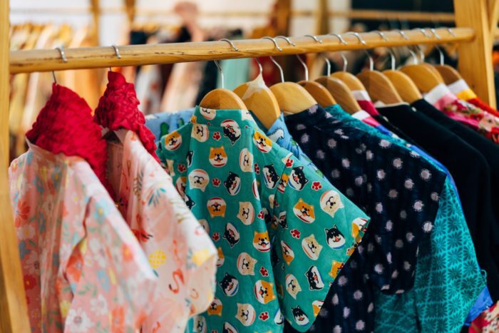 Shirts hung on a clothing rack inside a store
