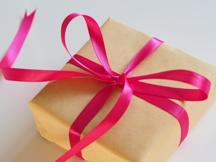 Gift wrapped with red ribbon